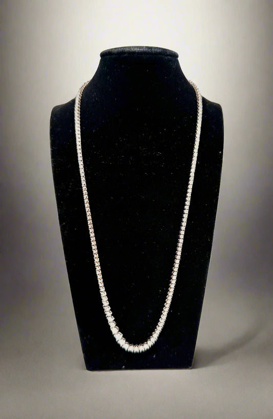 Diamond Necklace on a black velvet stand against a white background