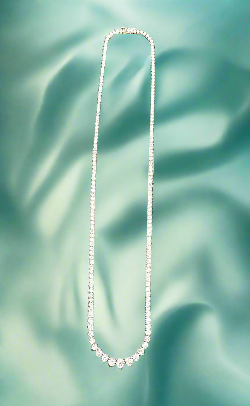 Diamond necklace on a gradient gray background
