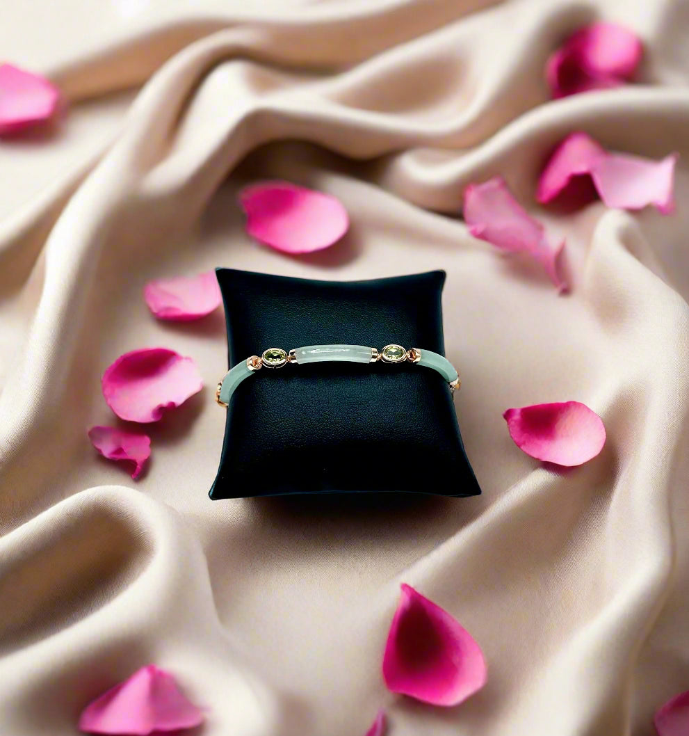 Bracelet on a black cushion against a white background